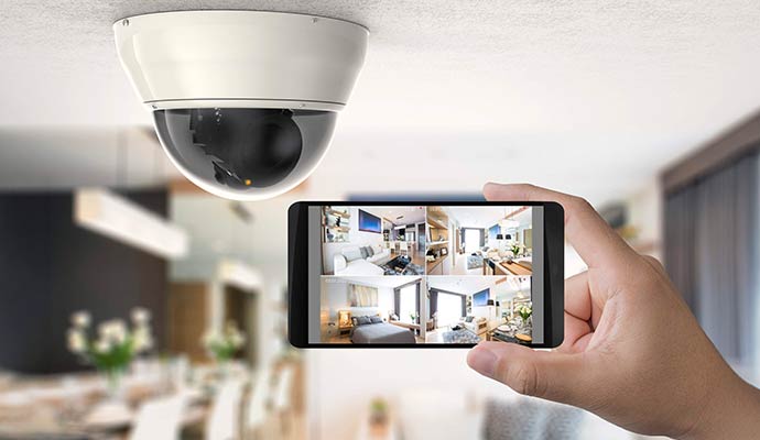 Ceiling mounted dome camera and smartphone app showing live feeds