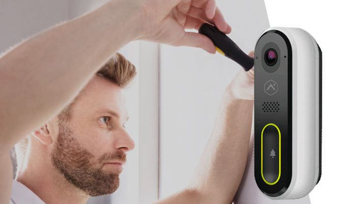Technician installing video doorbell