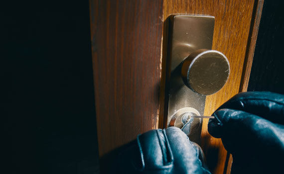 A burglar picking lock