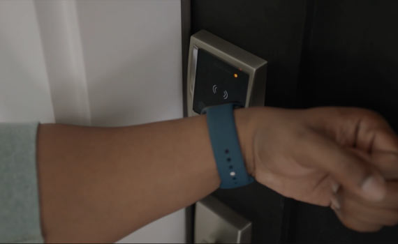 a person using schlage encode plus smart wifi deadbolt