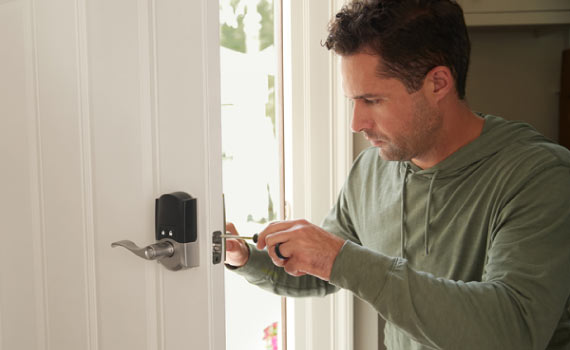 a person installing smart lock