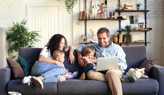 Happy family relaxing together on a sofa in the living room