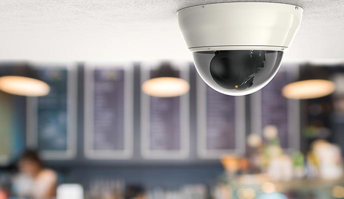 Dome security camera installed on ceiling for indoor surveillance