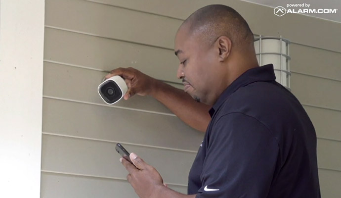 Technician installing security camera