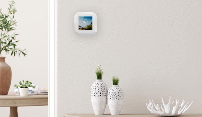Smart thermostat installed on the wall